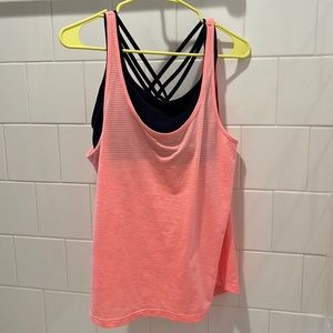Athleta athletic tank top with built in navy criss-cross bra. Hardly worn